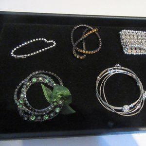 Assorted bracelets with rhinestones.  Great for the holidays.
